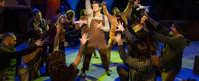 actors on stage in a musical