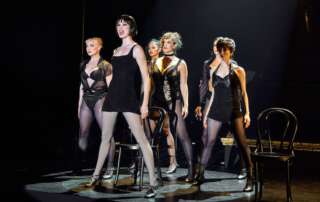 actors onstage in the musical Chicago