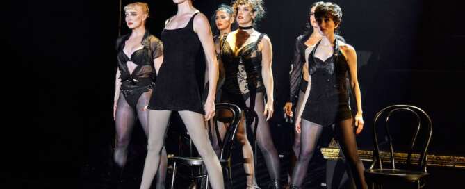 actors onstage in the musical Chicago