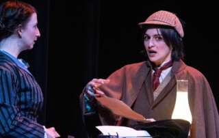 actors on stage in a play