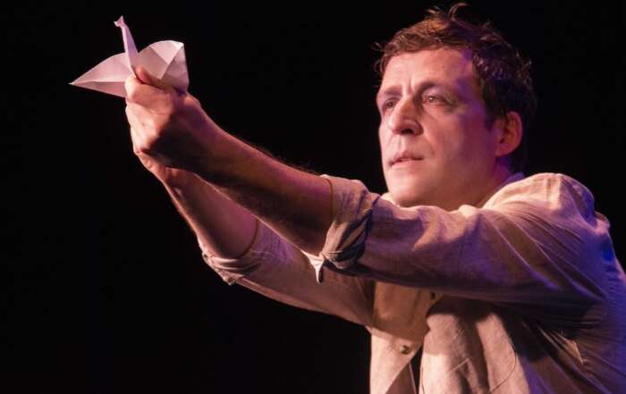 Podcast: Where theatre and Earth Day collide 2 actor on stage with paper bird