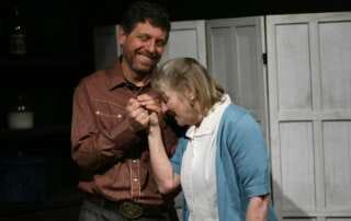 actors on stage in a play