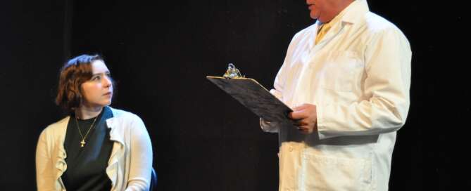 actors on stage in a play