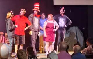 actors onstage in a play