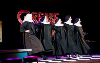 actors onstage in a play