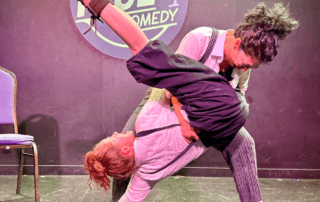 actors onstage in a comedy