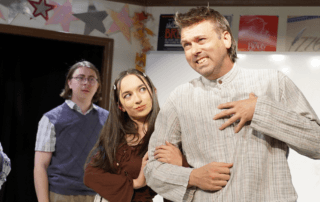 actors onstage in a play