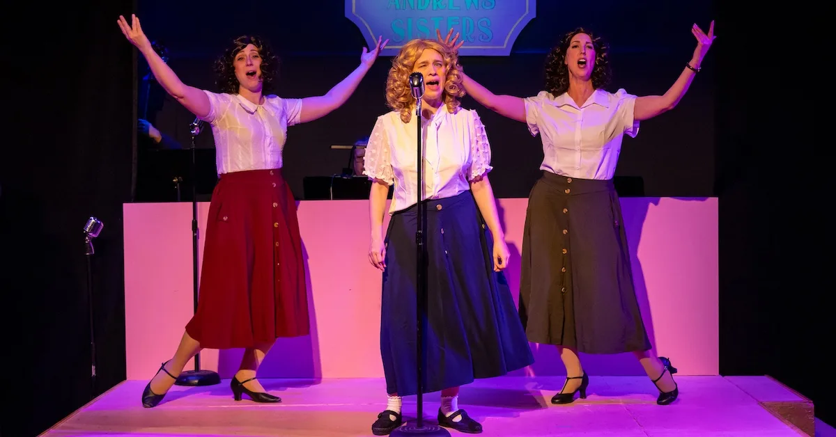actors onstage in a musical