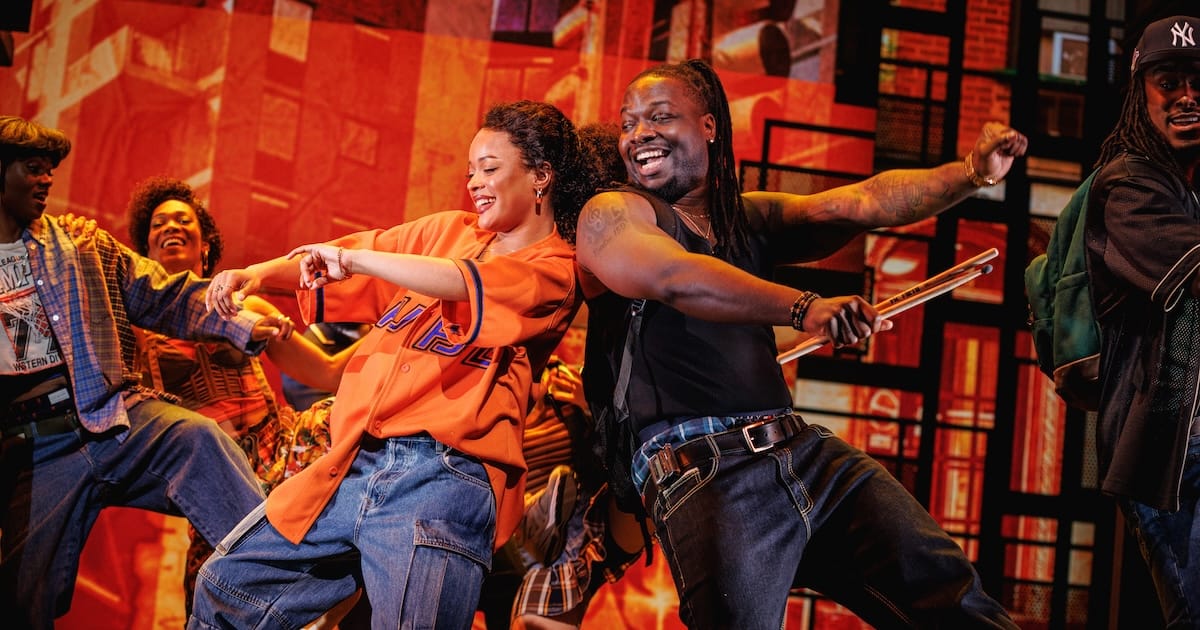 actors onstage in a musical