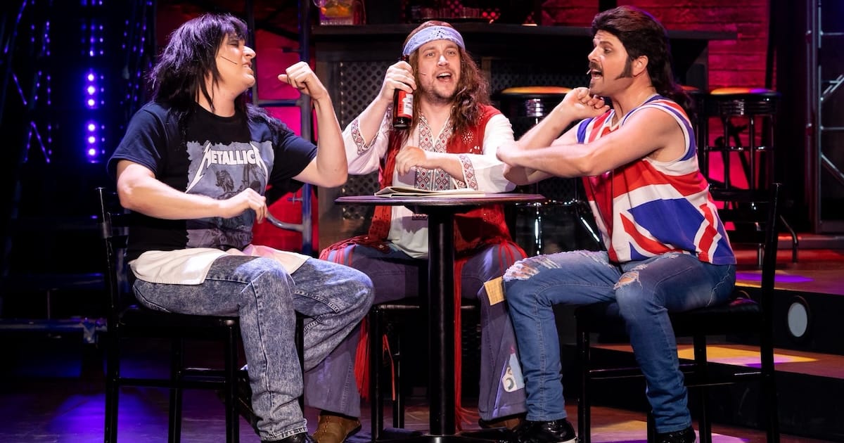 actors onstage in a musical