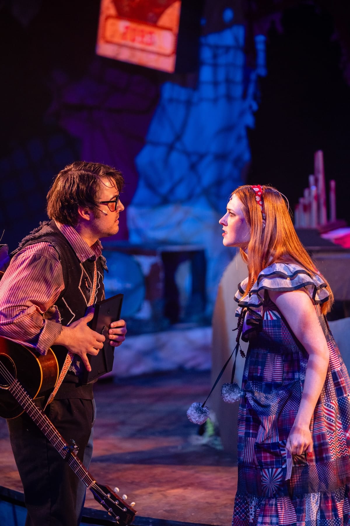 actors onstage in a musical