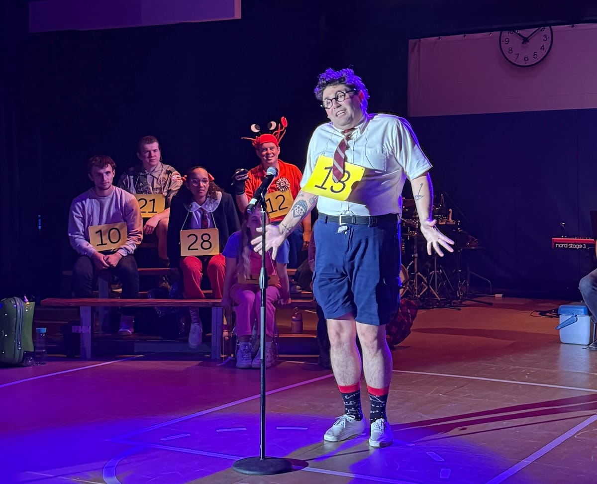 actors onstage in a musical