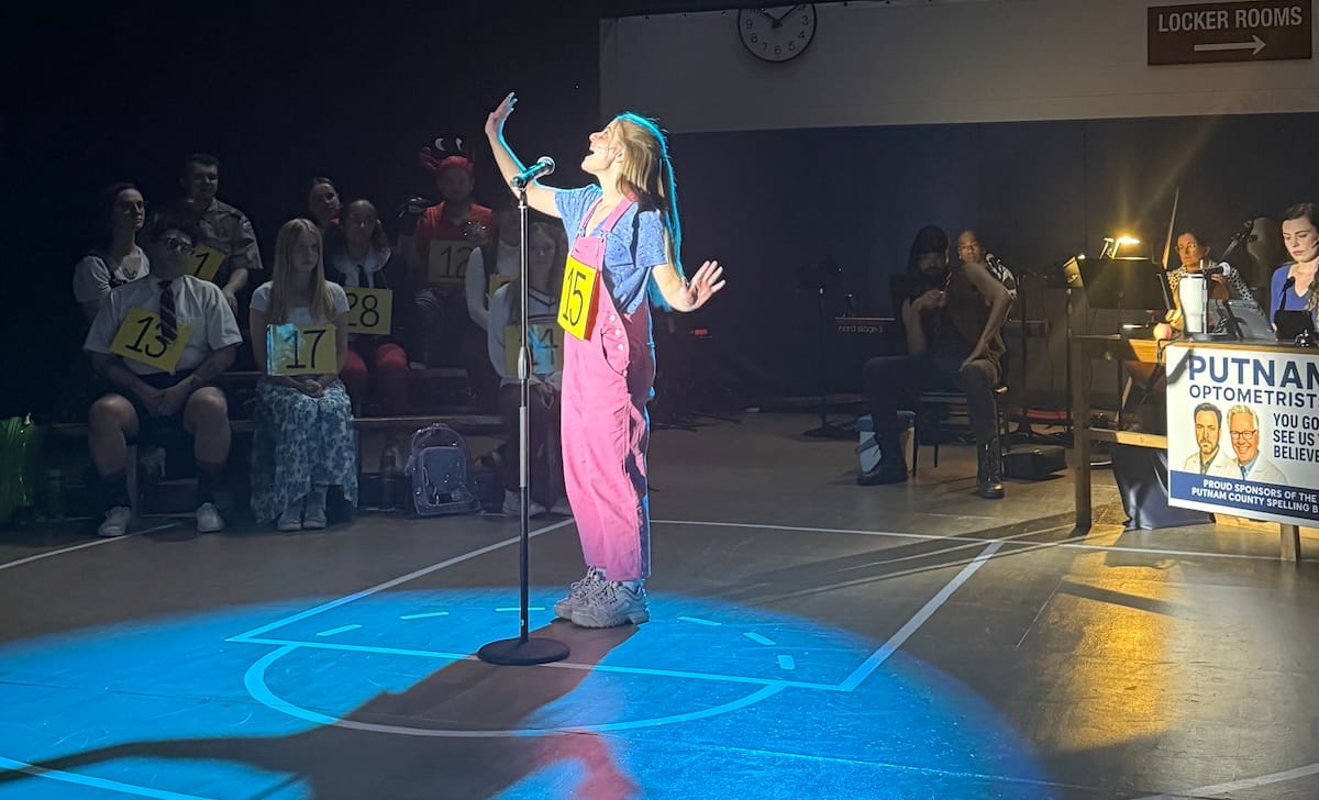 actors onstage in a musical