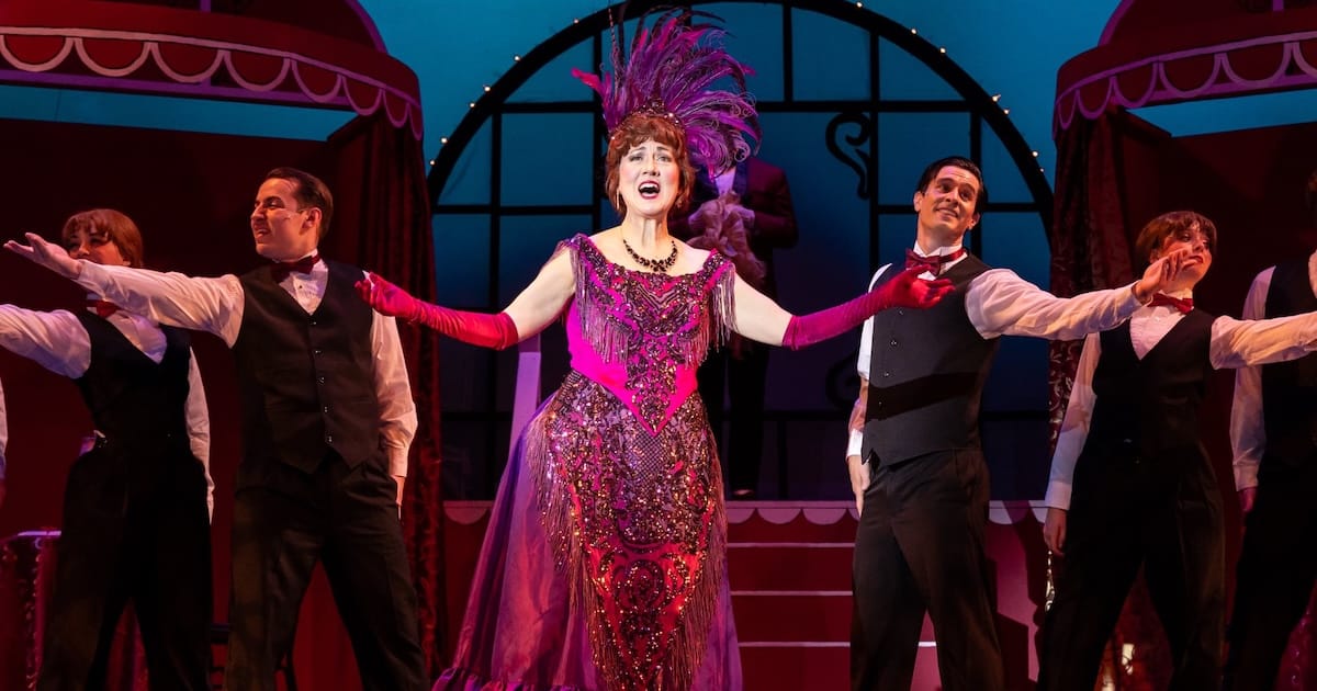 actors onstage in a musical