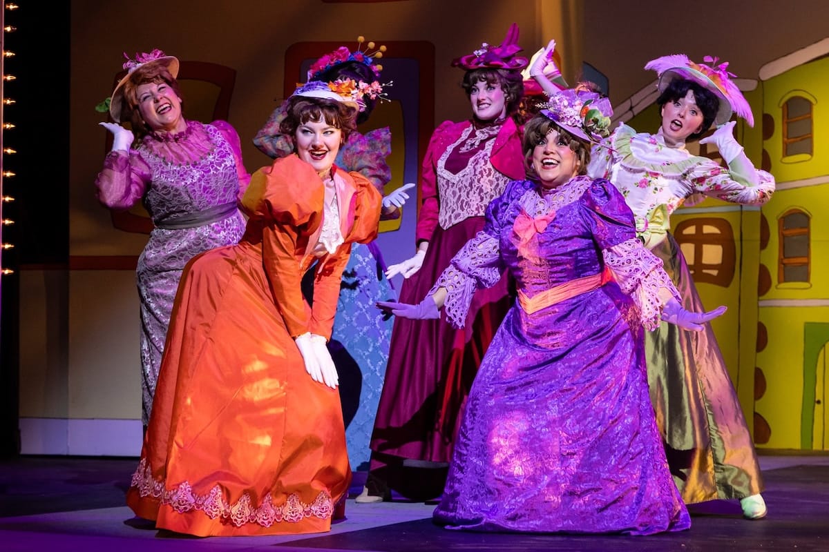 actors onstage in a musical 