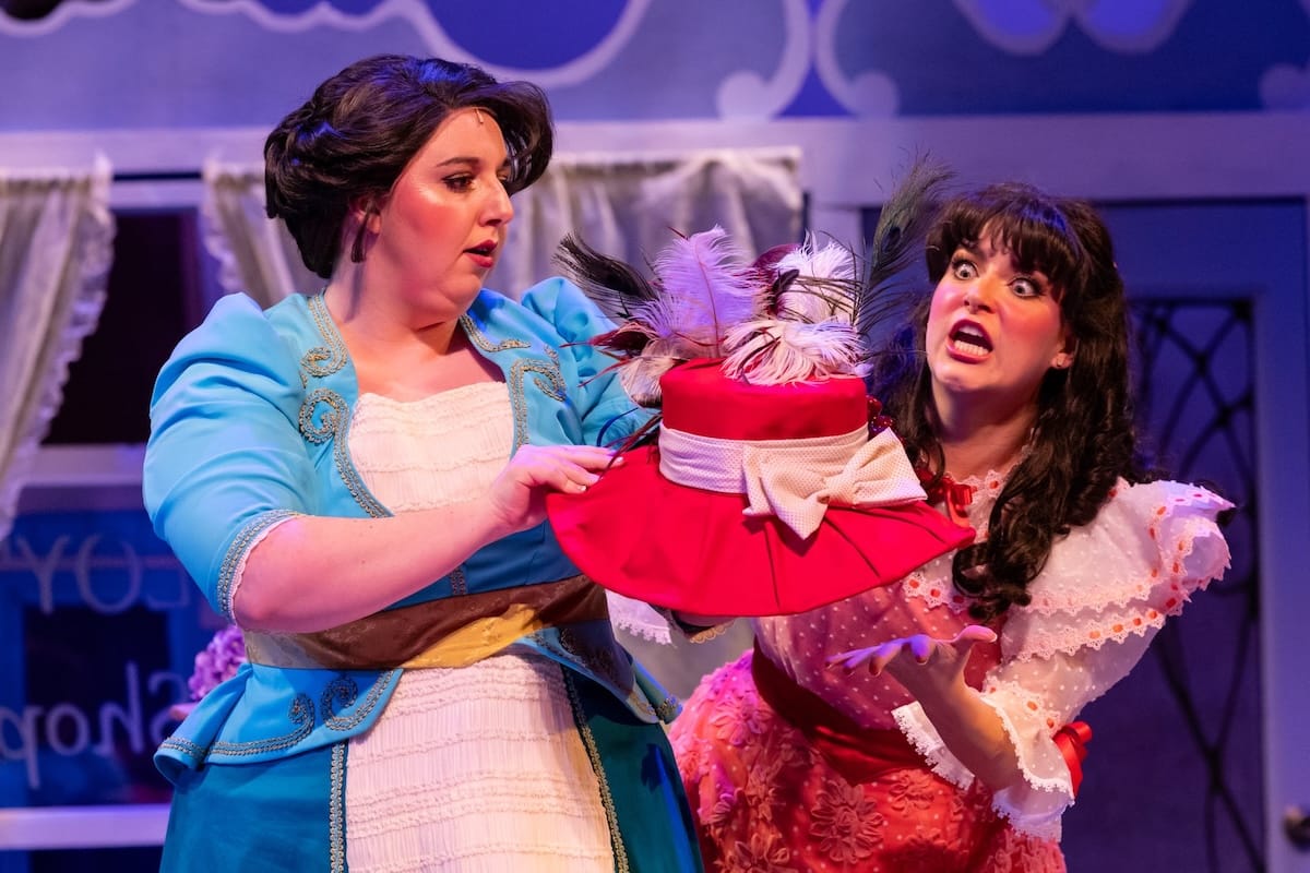 actors onstage in a musical 