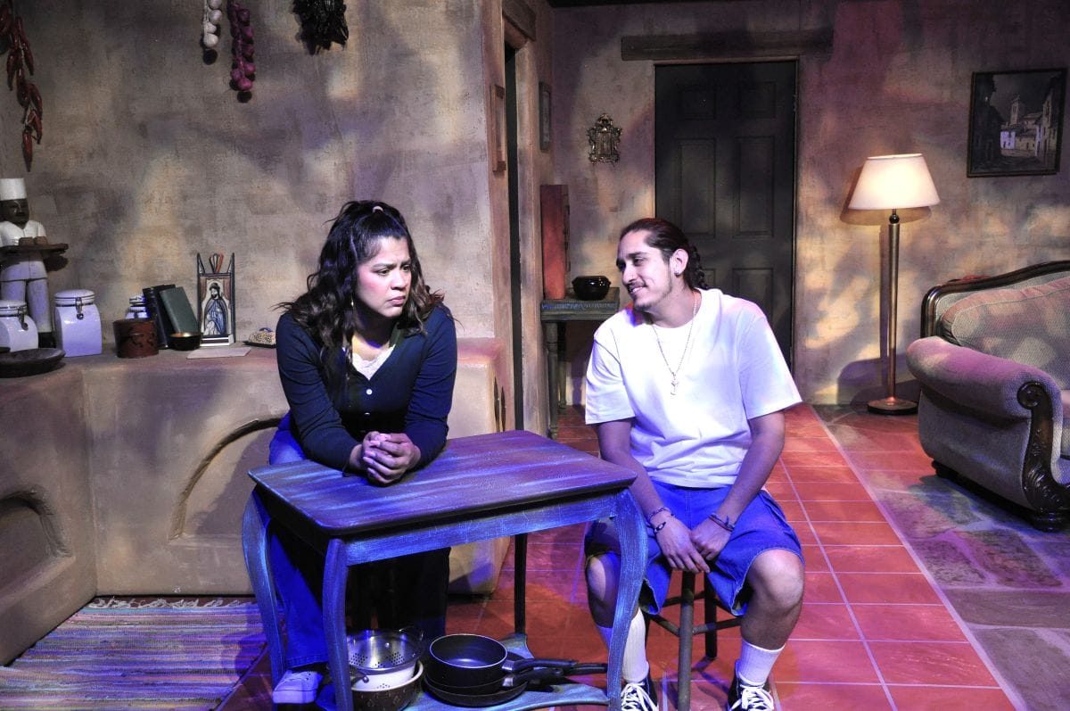 The devil’s in the details in ‘H-E Double Crooked Letter’ 2 Lourdes and Juan in kitchen resized