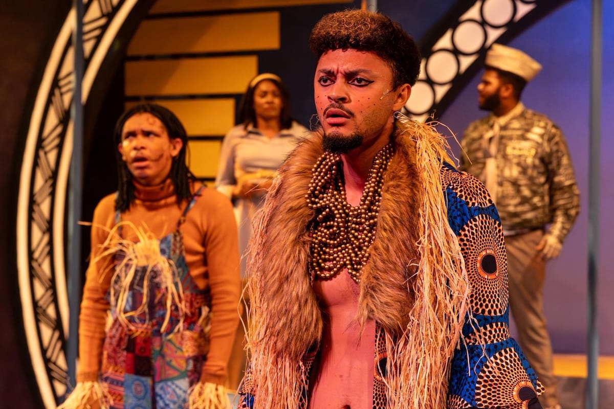 actors onstage in a musical 