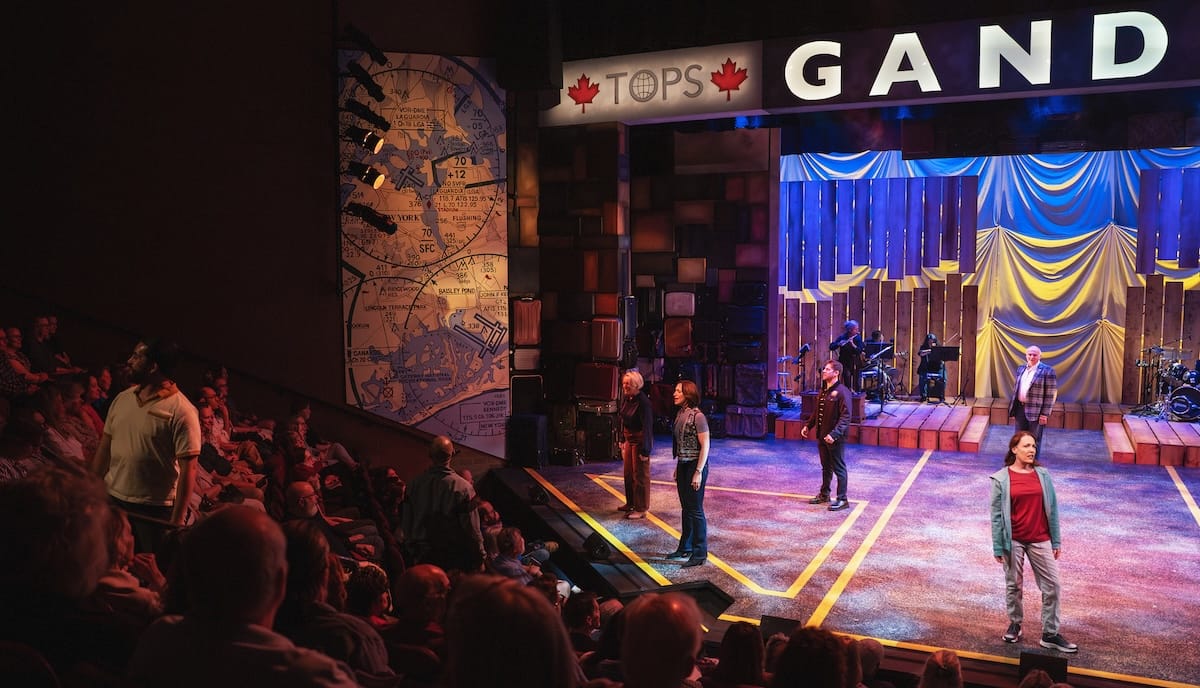 actors onstage in a musical 