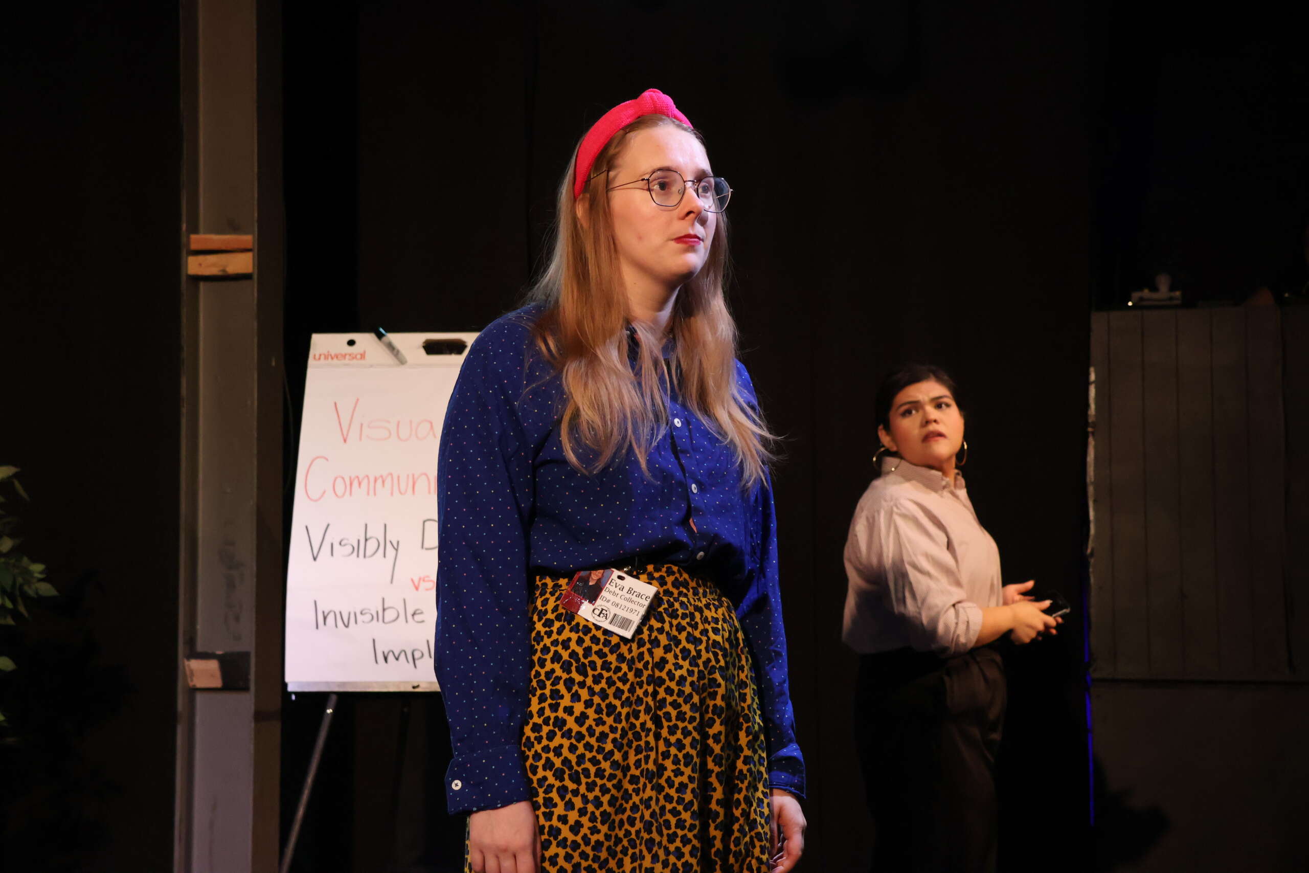 Office life goes to hell in 'Do You Feel Anger?' 3 Two woman stand onstage