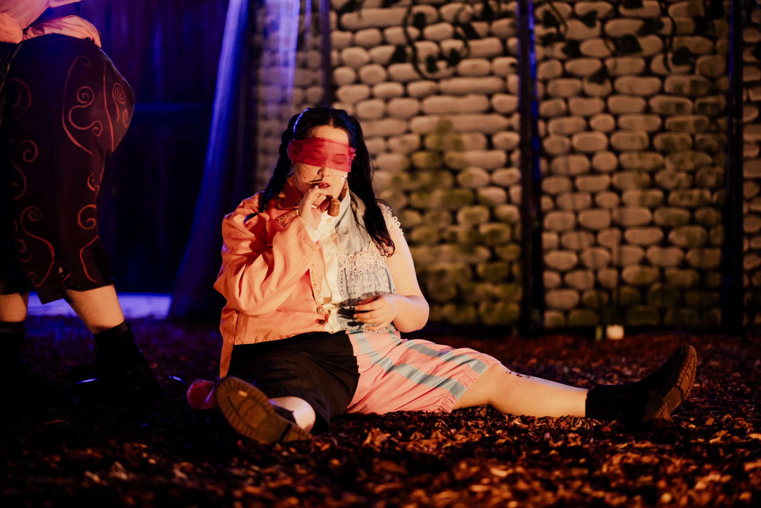 An actor performs and smokes weed outdoors