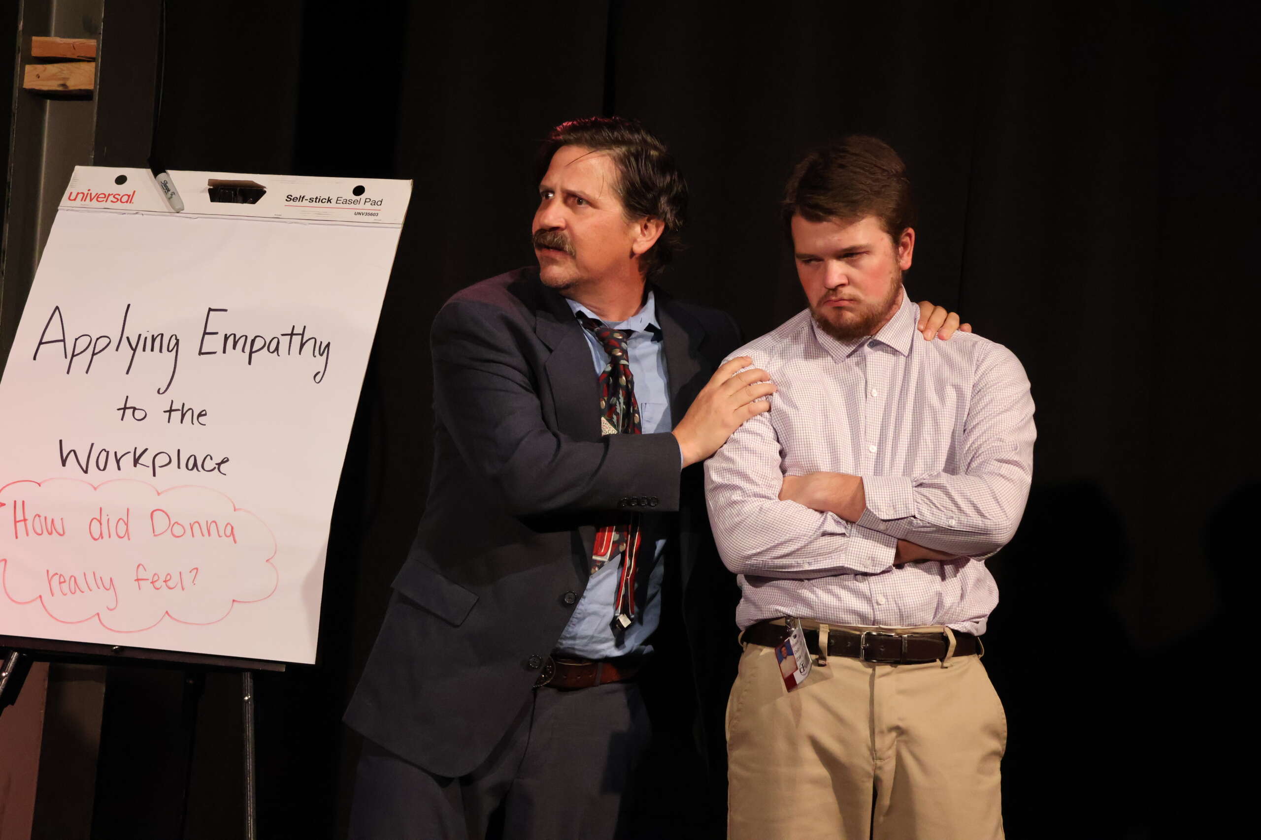 Office life goes to hell in 'Do You Feel Anger?' 6 Two men stand together onstage
