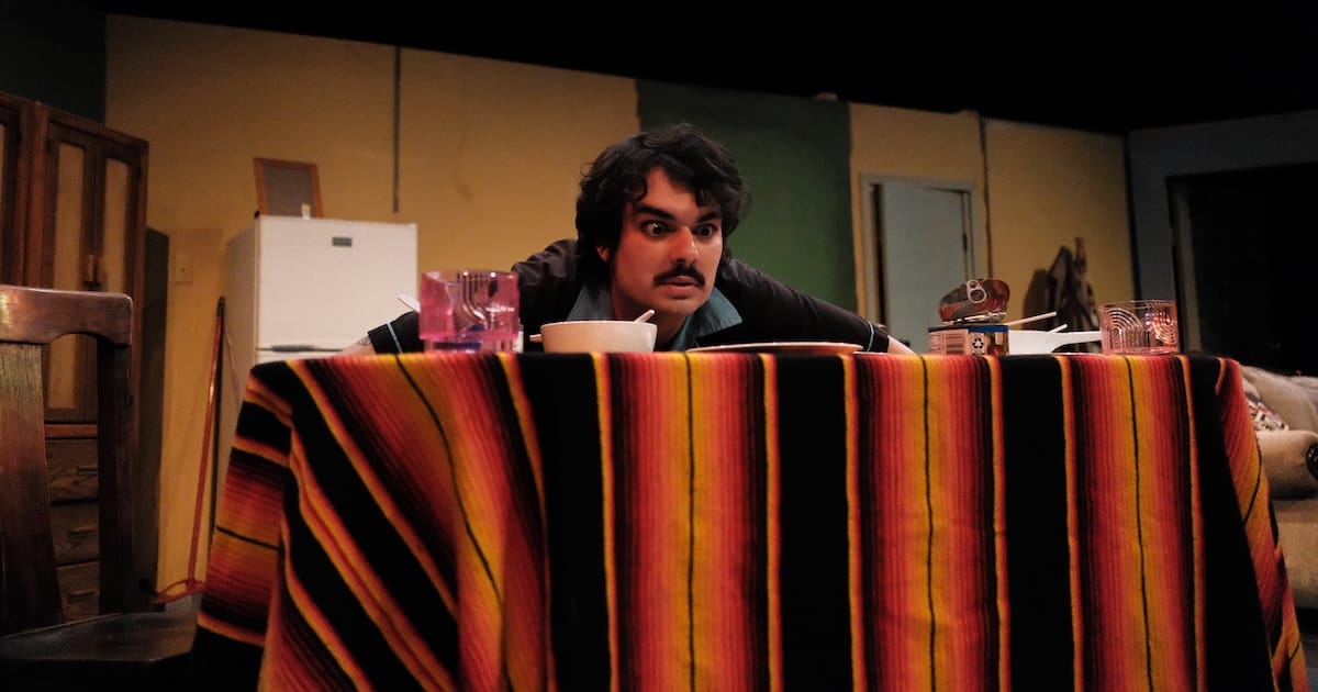 A man looks at food on a table