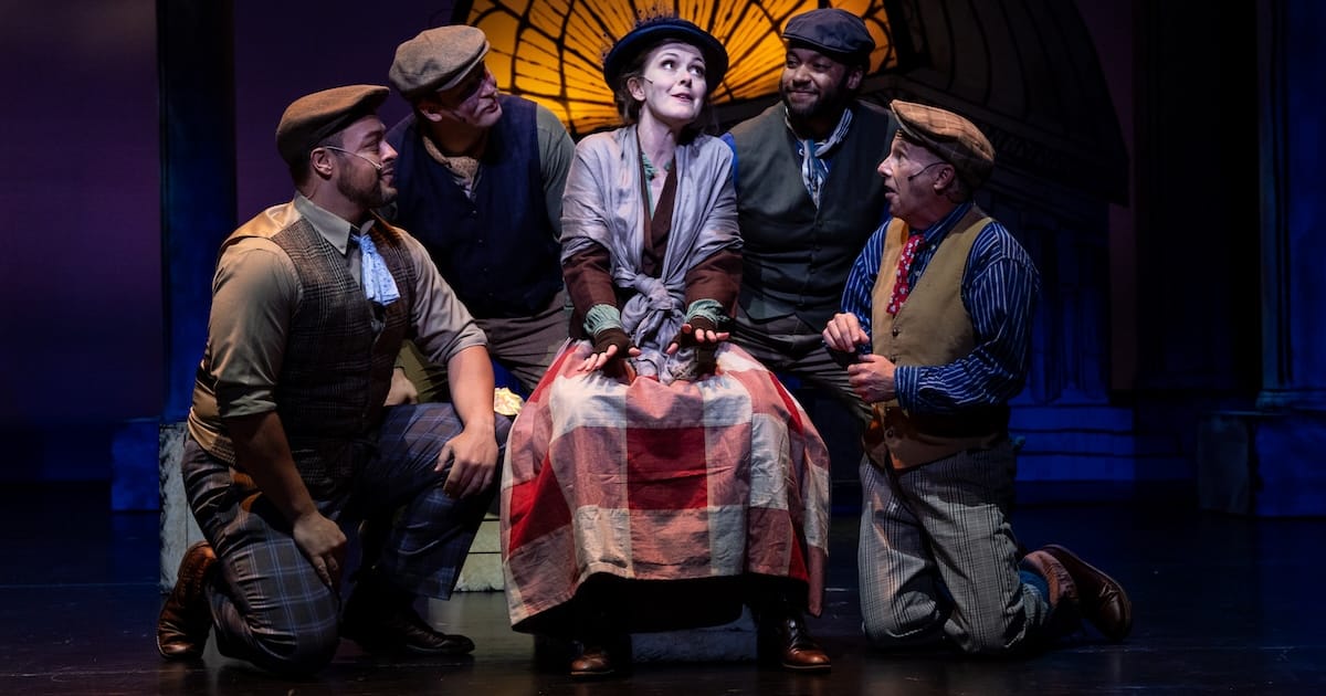 Five actors perform onstage