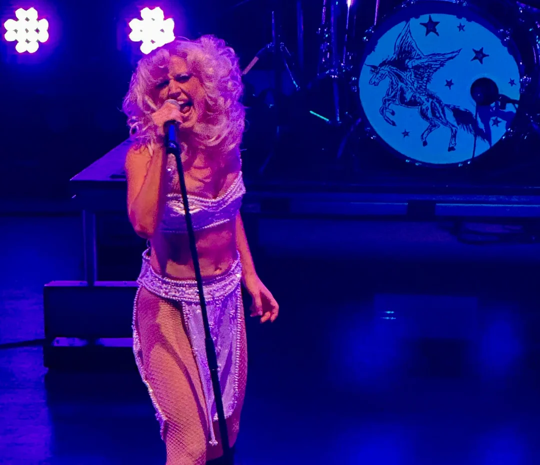 Woman sings onstage