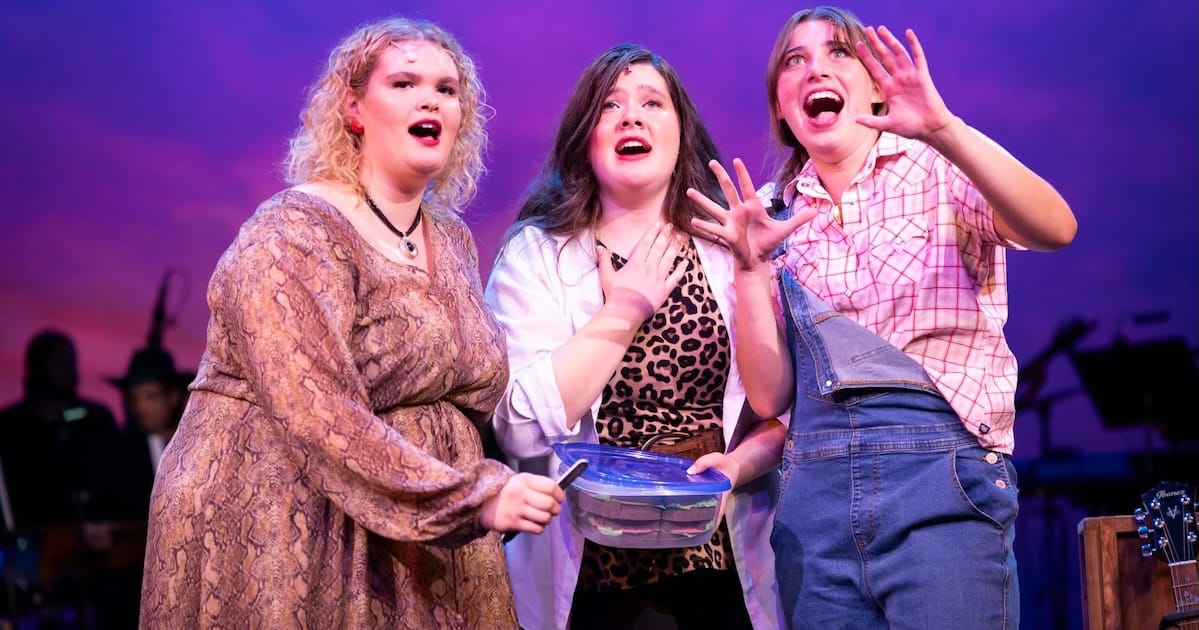 Three woman sing together