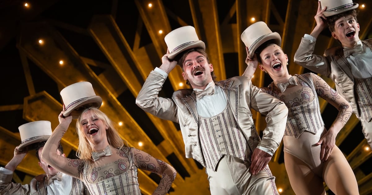 actors onstage in a musical