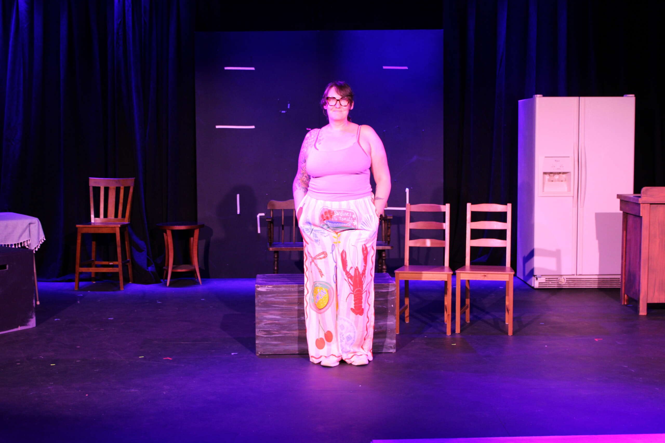 Woman poses on a stage