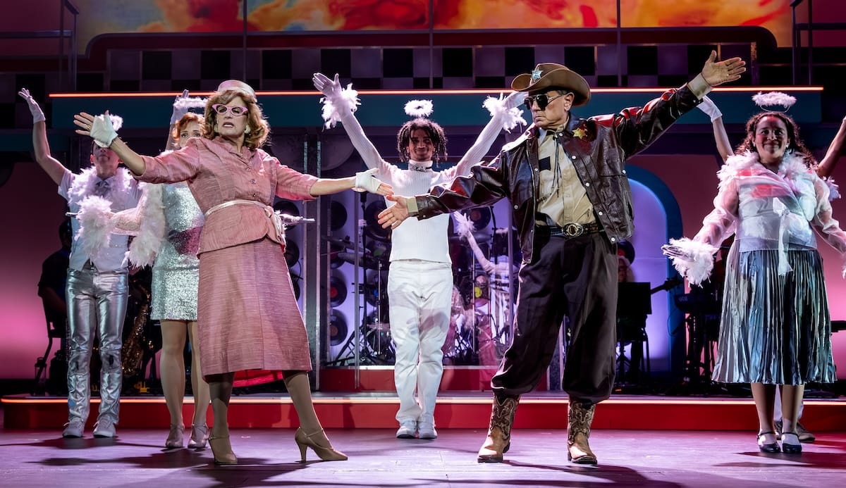 actors onstage in a musical 