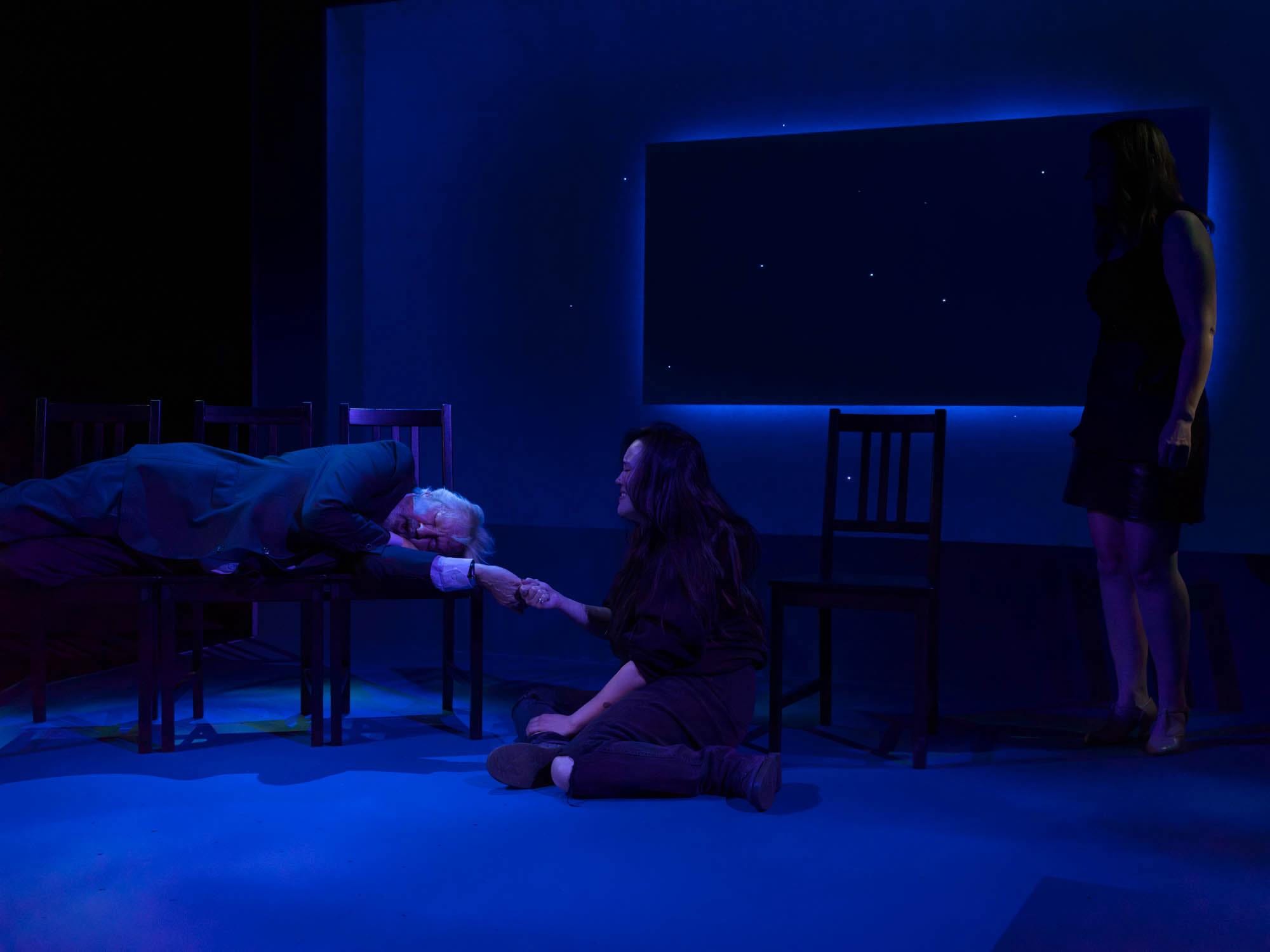 'Closing Times' reckons with a lifetime of regrets 4 A man lies down, while a person crouches nearby.