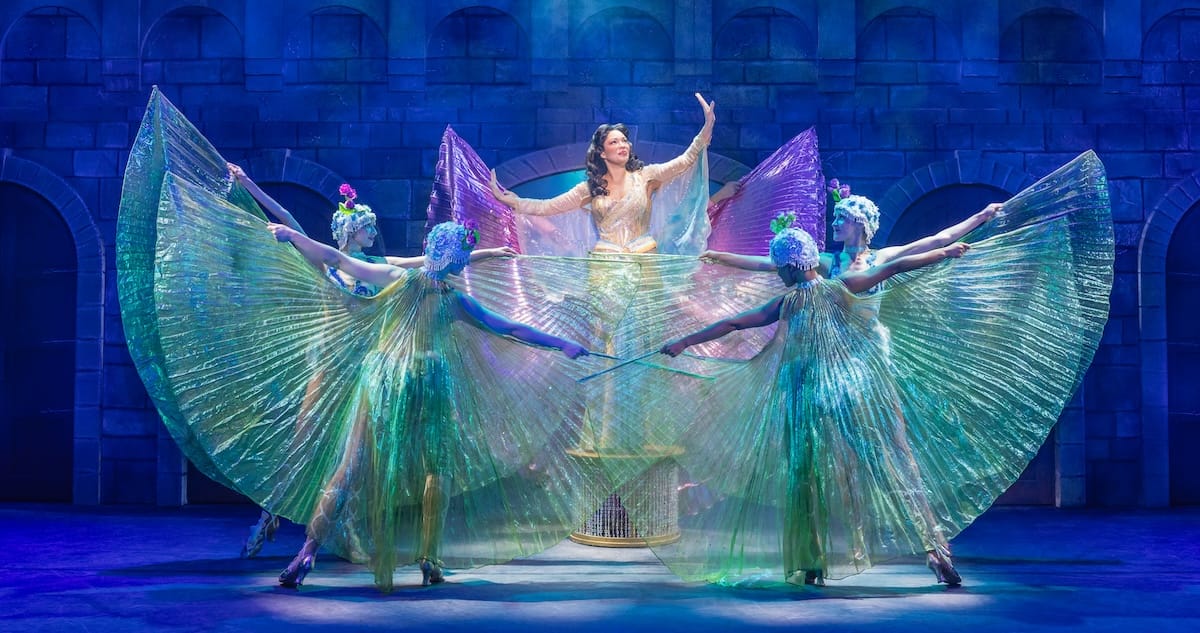 actors onstage in a musical 