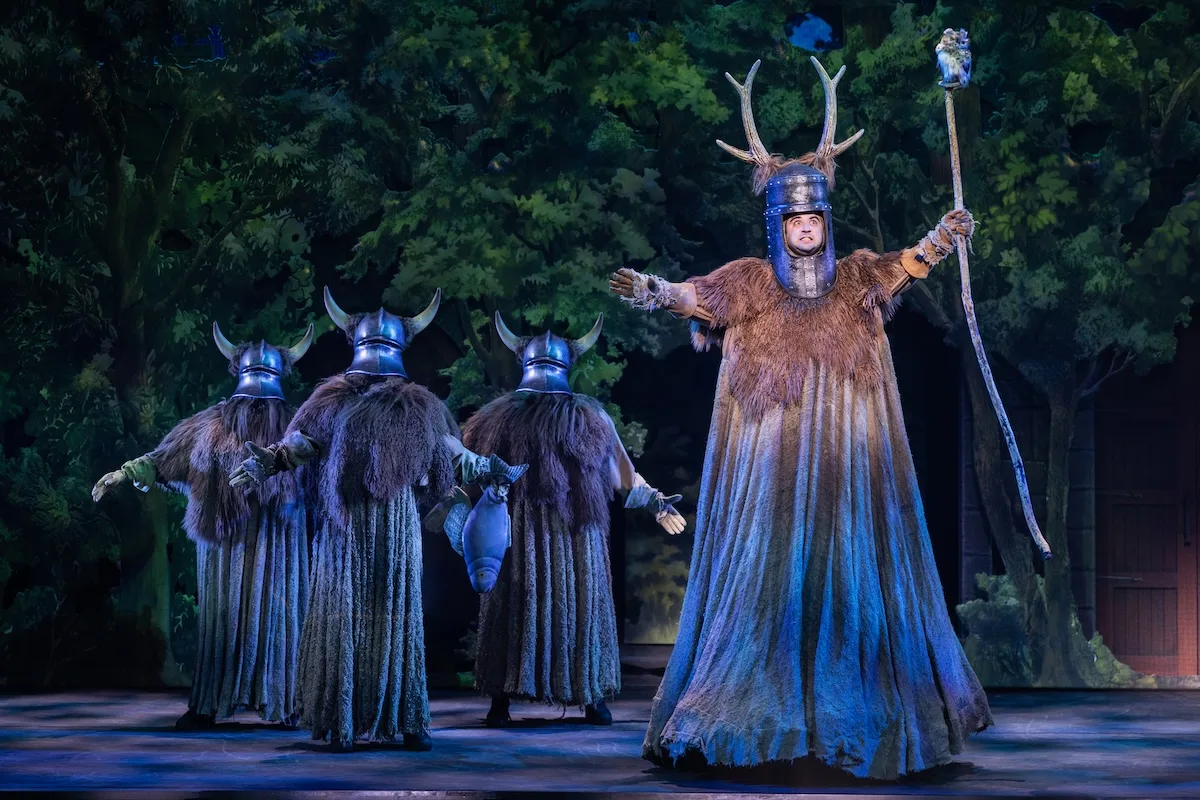 actors onstage in a musical