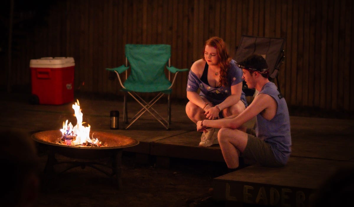 Tradition and change collide around the campfire in ‘The Grown-Ups' 3 Two people sit around a campfire in The Grown-Ups