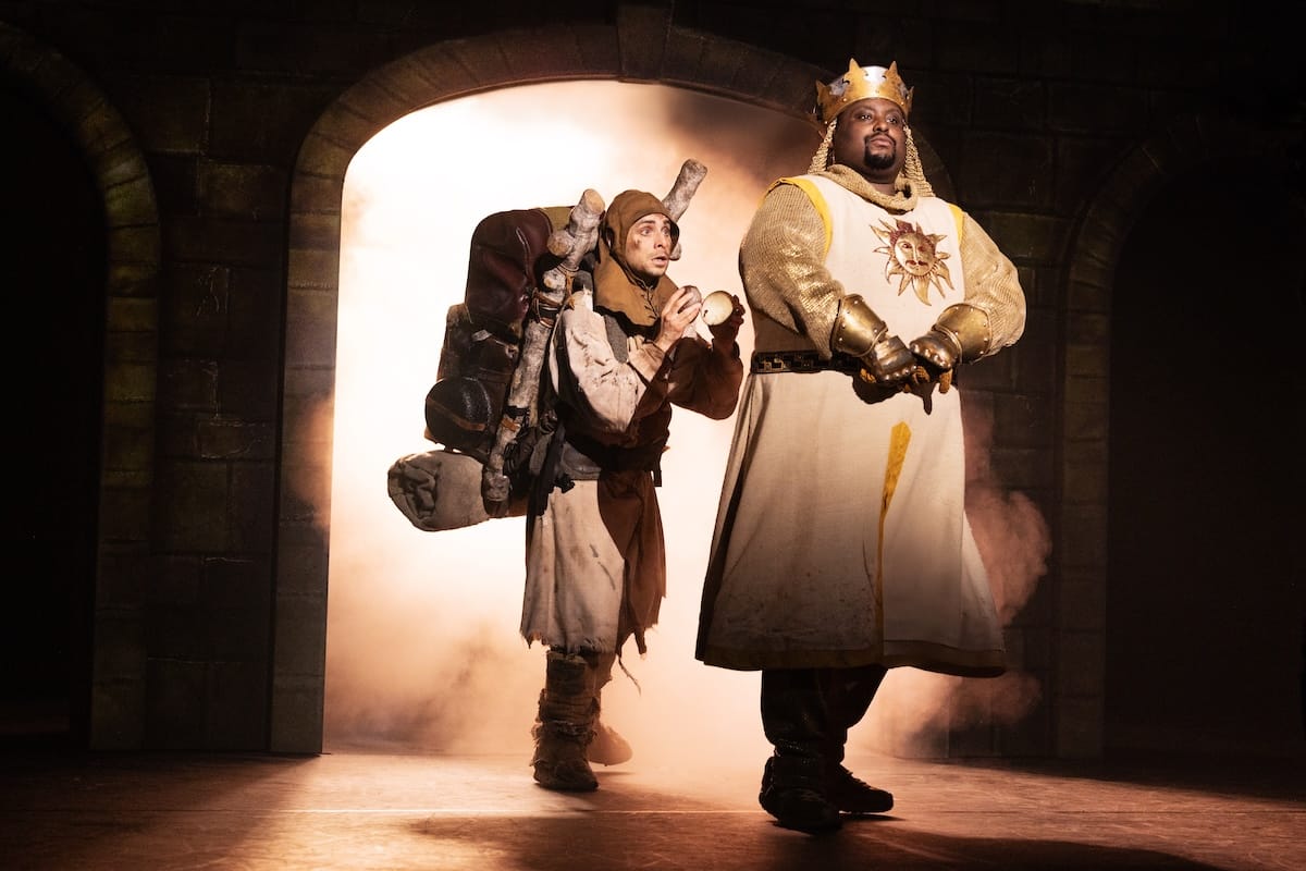 actors onstage in a musical 