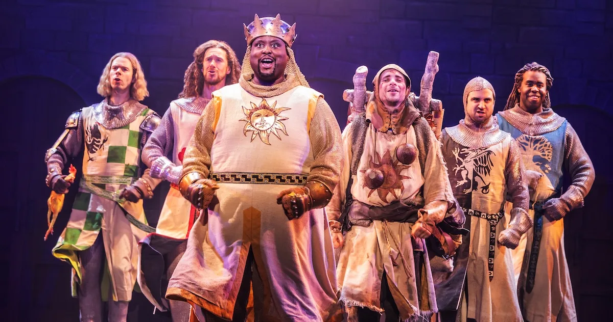 actors onstage in a musical