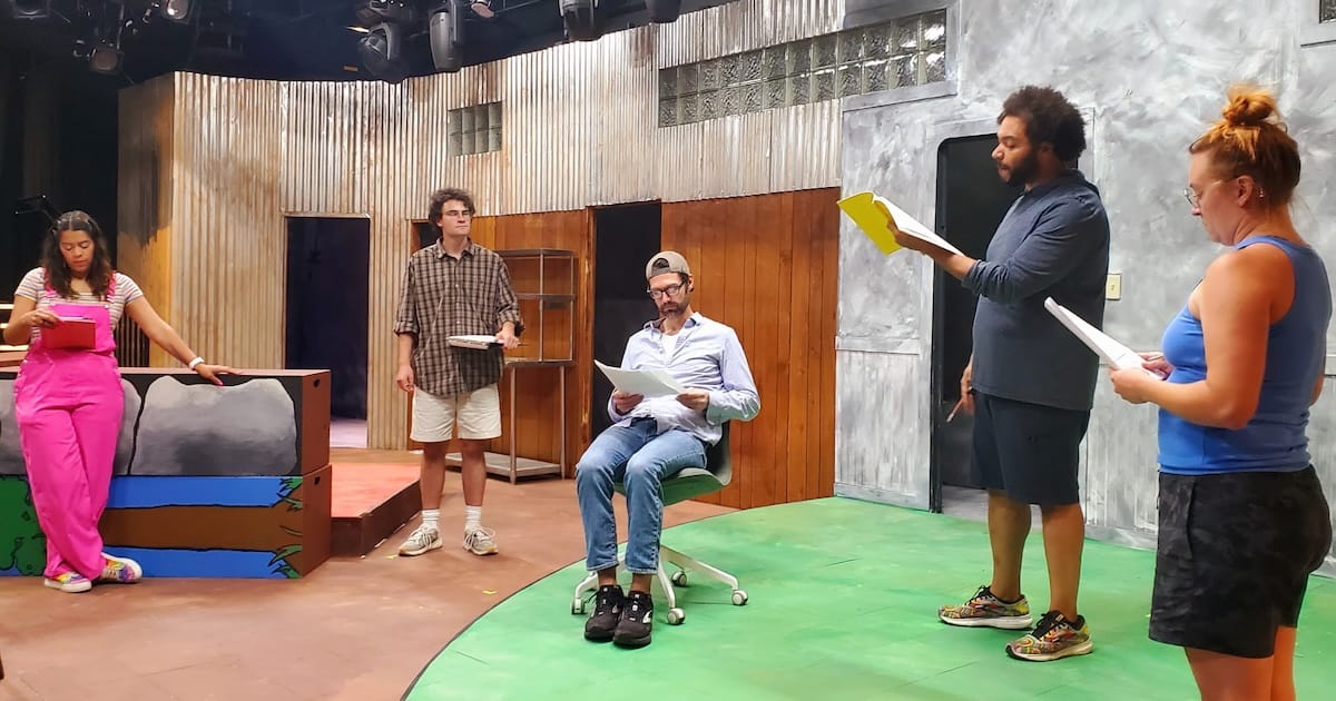 actors onstage in a play