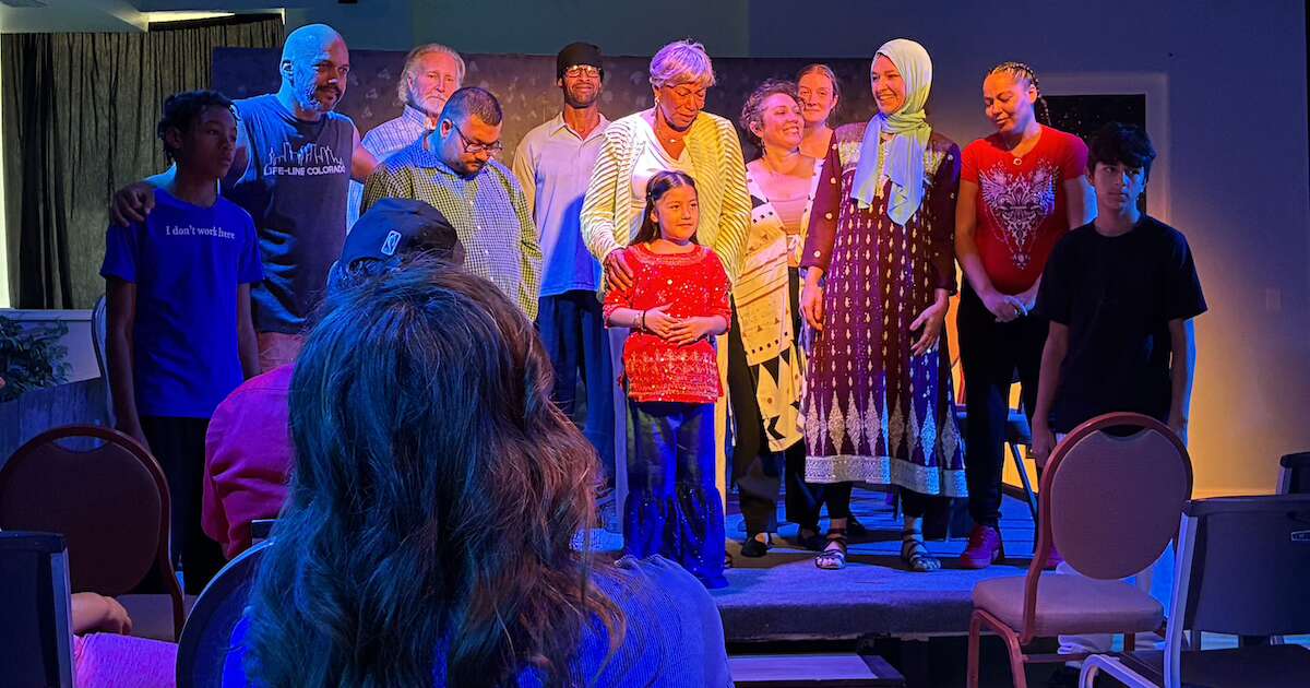 People stand together onstage in "Route 15"