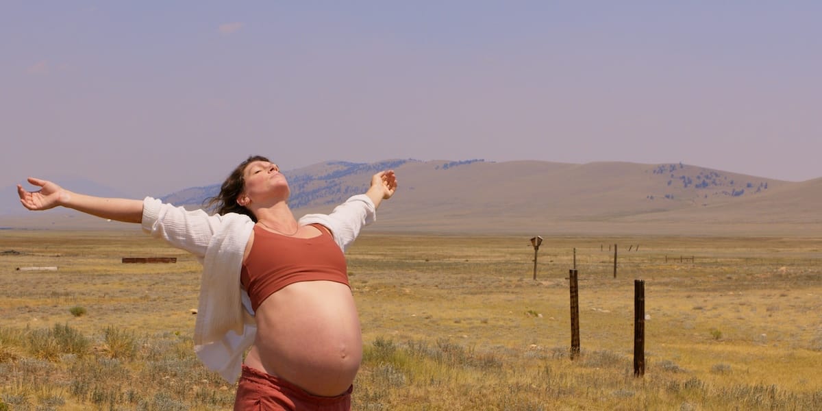 A pregnant woman dances outdoors in "mother: un/tethered"
