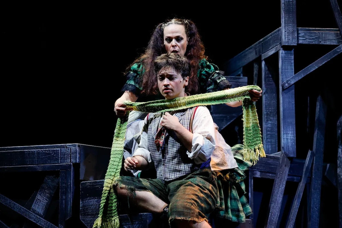 actors onstage in a musical 