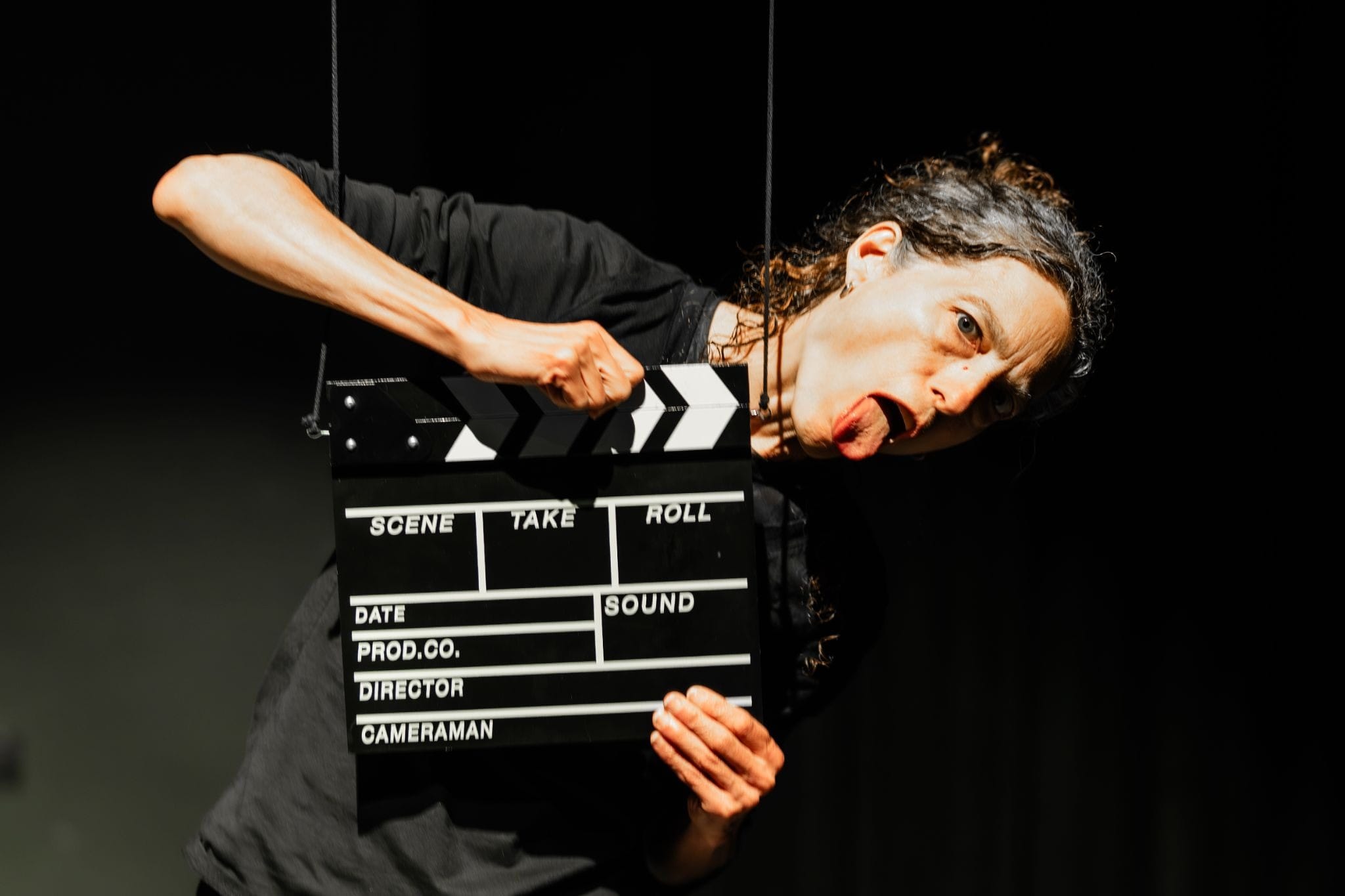 A woman with a clapperboard