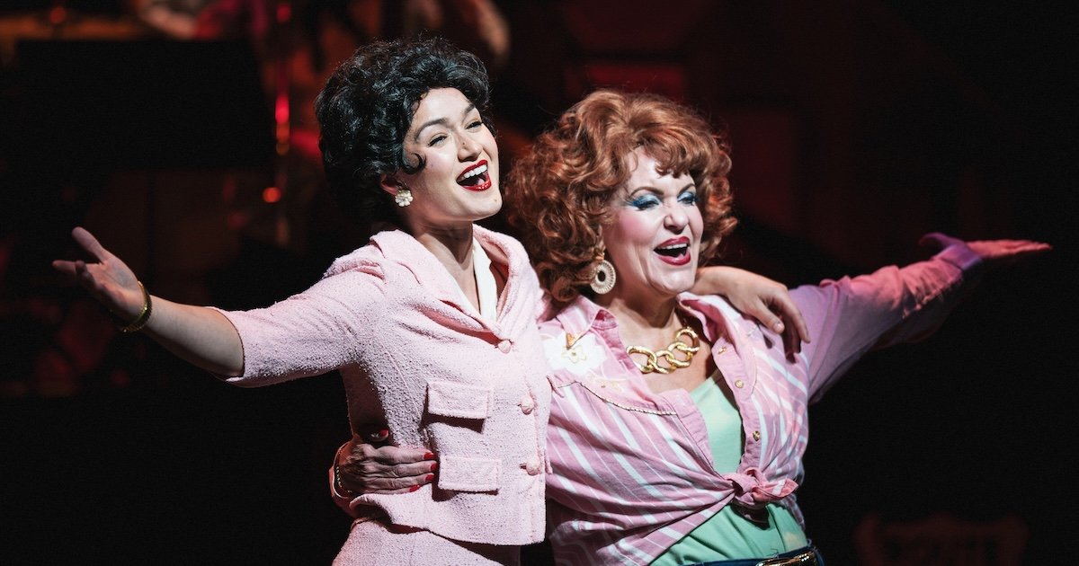 actors onstage in a musical