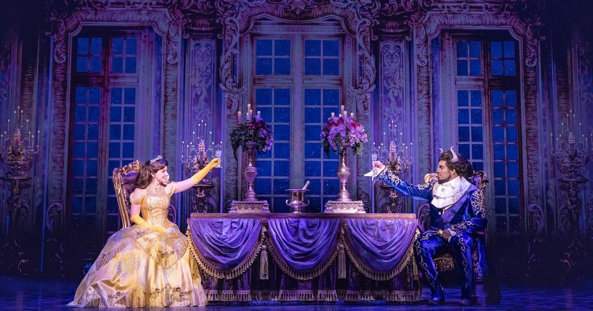 Beauty and the screens 5 Two people raise glasses at each other