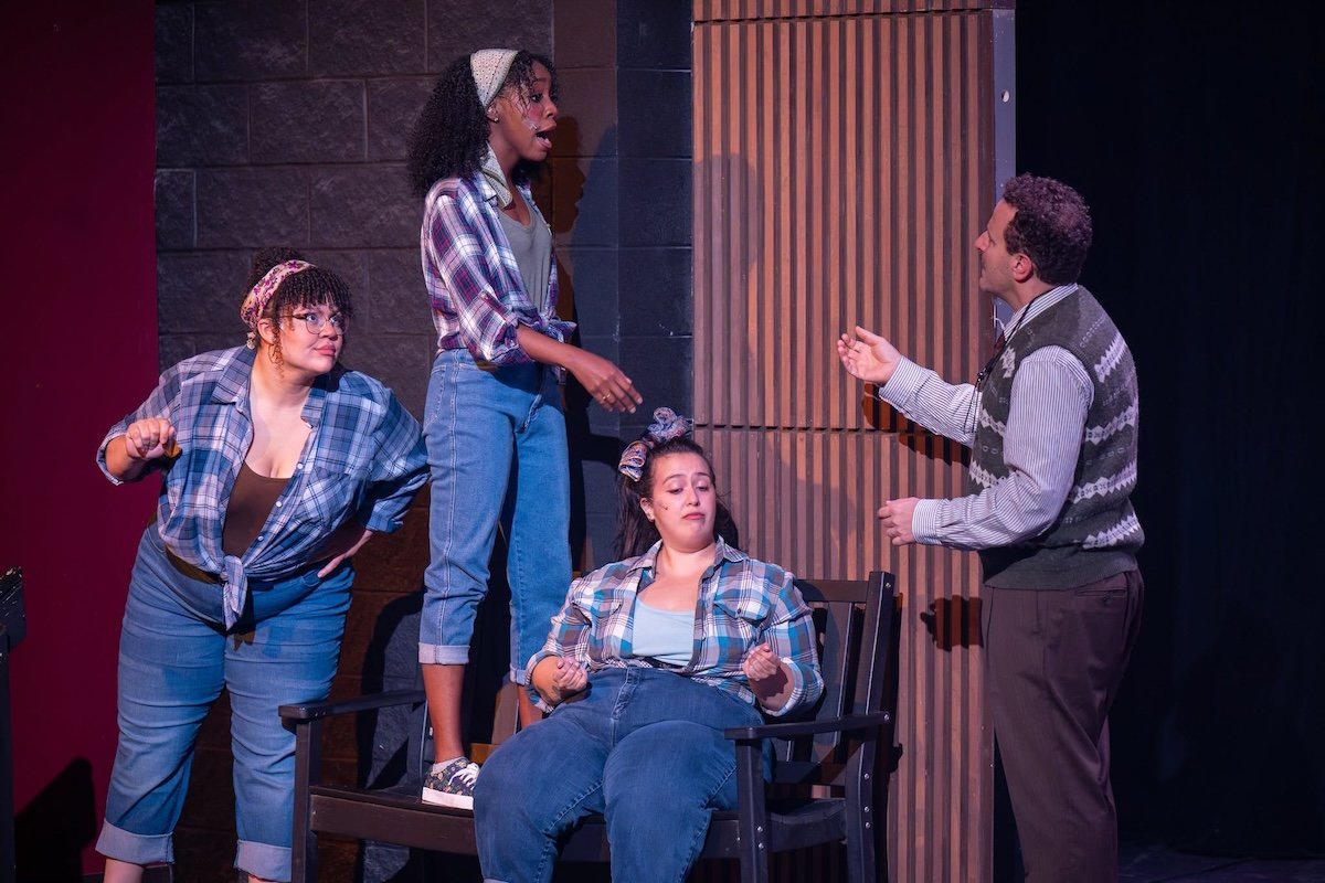 actors onstage in a musical 